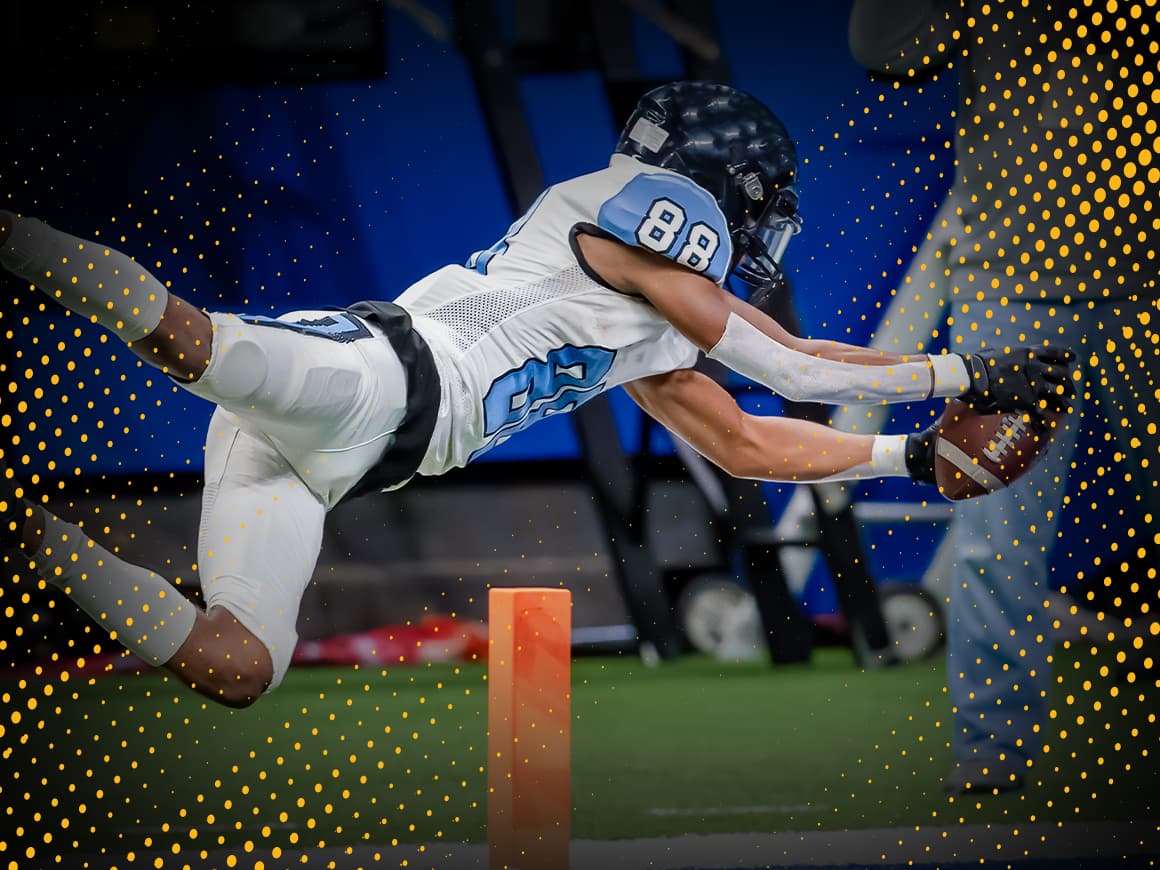 football player in custom BSN SPORTS gear diving for the endzone