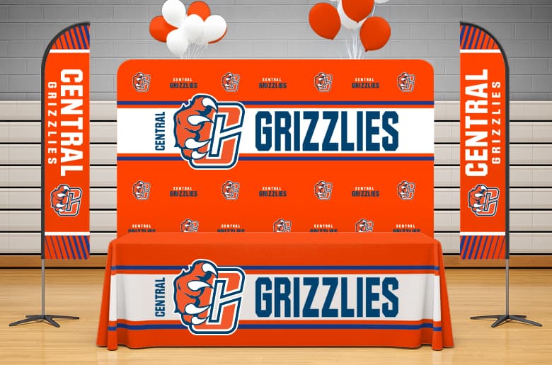 Custom branded campus branding items such as tablecloths, feather flags, and media backdrops
